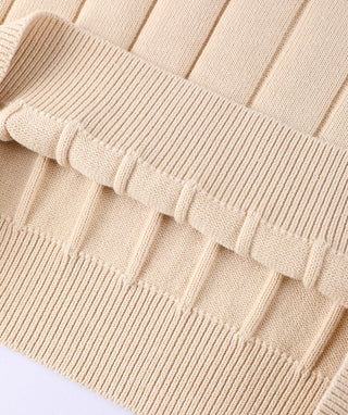 White cotton V-neck sweater with ribbed hem and cuffs, visible knit texture and contrast trim