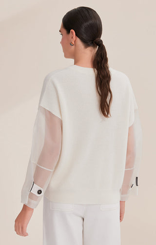 White wool knit top back view with ribbed texture and sheer organza sleeve panels