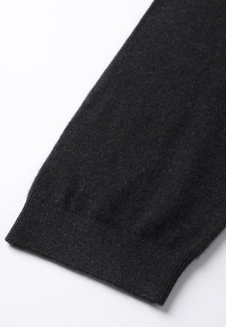 Dark grey cashmere knit sweater cuff detail with ribbed trim.