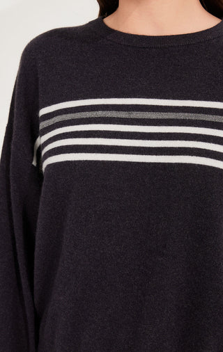 Dark gray cashmere-knit sweater close-up; horizontal stripes across the chest