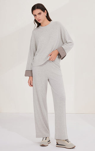 Light gray relaxed knit sweater set with checked cuffs and matching drawstring-style pants
