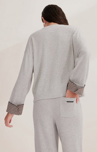 Light gray cashmere sweater back view with checked cuff trim and relaxed silhouette