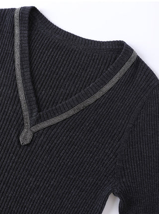 Ribbed wool V-neck sweater in black with beaded trim along the neckline and shoulder.