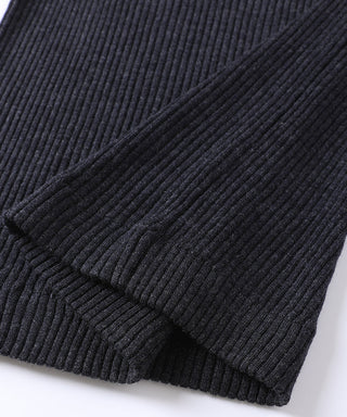 Dark ribbed wool cuff and sleeve seam close-up