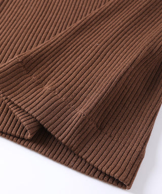 Brown ribbed wool sweater hem with fine vertical knit texture and neat cuff edge.