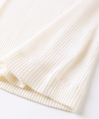 Ivory ribbed knit cuff and hem detail of V-neck wool sweater