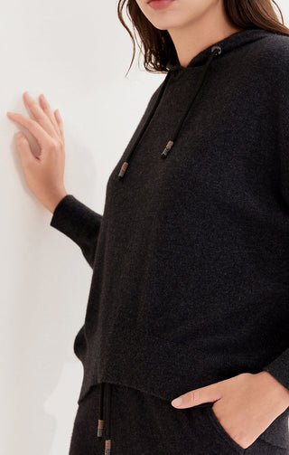 Black hooded cashmere pullover detail with front drawstring and side hem