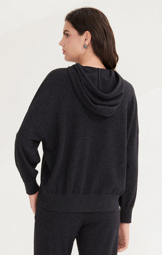 Black cashmere hooded pullover from back view with draped cowl hood