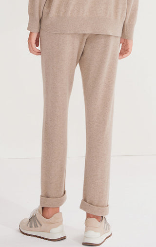 Camel cashmere knit pants on model, relaxed fit with cuffed ankles