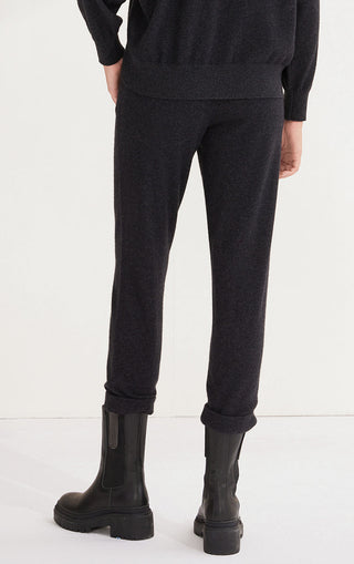 Black cashmere knit pants, ankle cuffs and tapered silhouette