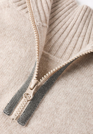 Half-zip zipper detail on camel wool sweater with contrasting dark and beige trims