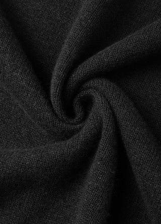 Black wool fabric close-up with smooth knit texture and soft drape