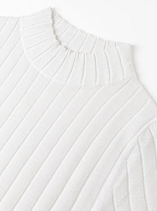 White ribbed turtleneck sweater with high collar and diagonal knit lines.