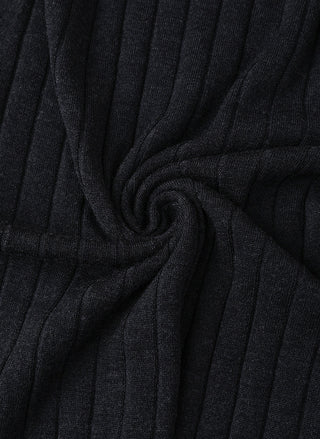 Black ribbed knit turtleneck sweater fabric detail with gathered texture.