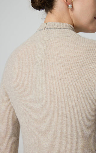 Close-up of camel cashmere sweater neck with ribbed knit texture