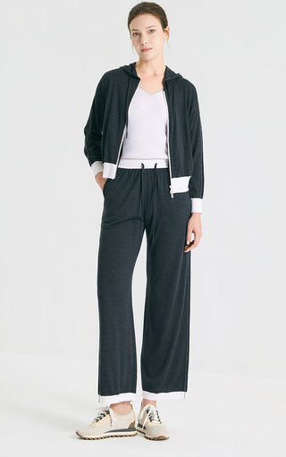Graphite gray hooded knit cardigan with front zipper and white cuffs; relaxed fit