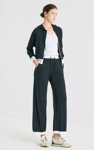 Graphite gray wide-leg knit pants on model, elastic drawstring waist and relaxed fit