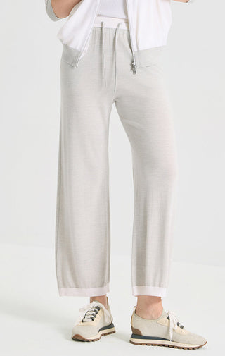 Light gray wide-leg knit pants with drawstring waist and front zip detail
