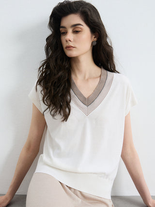 Ivory knit top with V-neck and contrast striped trim at neckline and sleeves