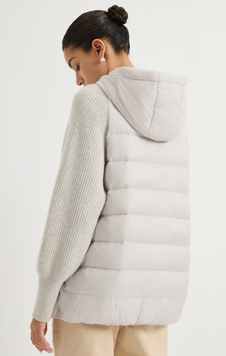 Light grey hooded puffer vest back view with quilted panels and attached hood
