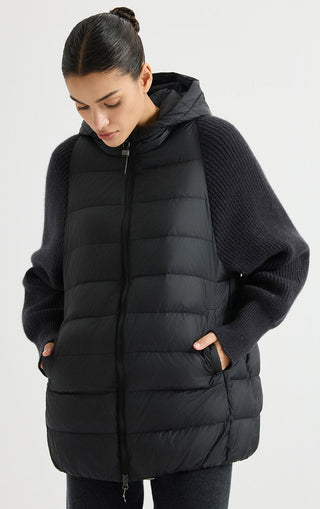 Black hooded puffer vest with ribbed knit sleeves, full-zip front, side pockets