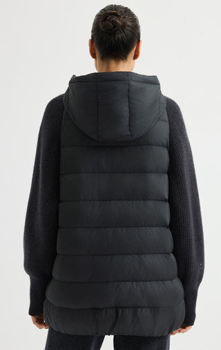 Black hooded puffer vest back view with quilted panels and attached hood