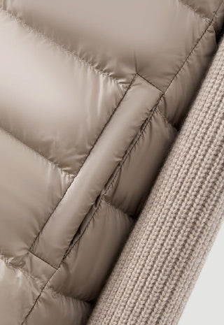 Camel quilted puffer panel with ribbed knit sleeve and stitched baffles