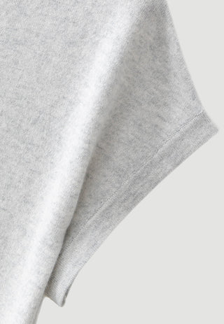Light grey cashmere knit sleeve cuff close-up with ribbed edge