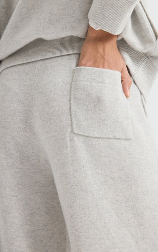 Light grey cashmere pants with front pocket detail and soft knit texture