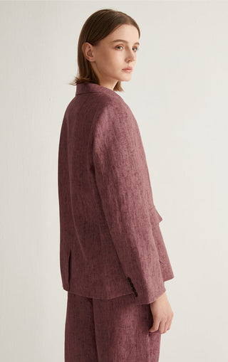 Rose linen-cotton tailored jacket shown from the side, button detail at center front