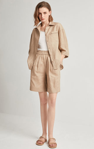 Khaki linen tailored shorts with elastic waistband and wide-leg hem