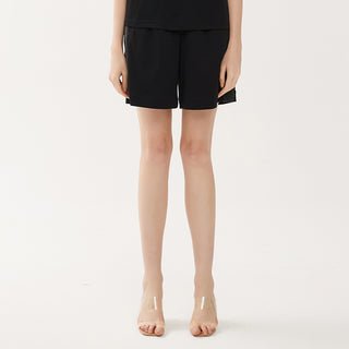 Black combed cotton shorts with elastic waist and beaded side stripe trim