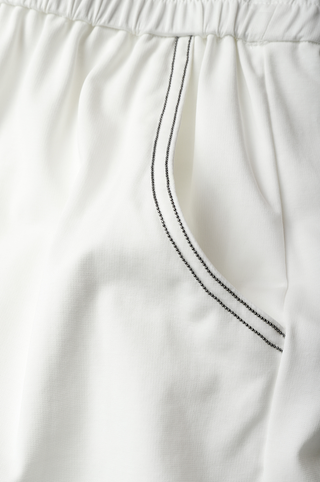 White shorts waist detail with black beaded drawstring and elastic casing