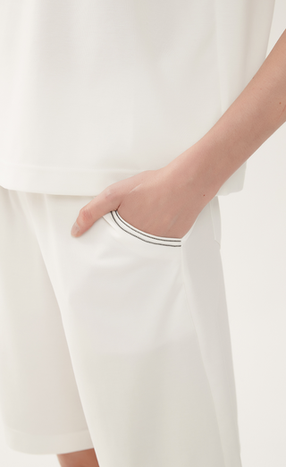 White tailored cotton-blend shorts with elastic waistband and side hand pockets