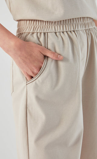 Khaki shorts close-up: elastic waistband with drawstring and side pocket