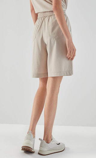Khaki tailored shorts from side, elastic waistband and side pocket detailing