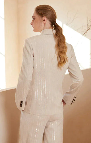 Beige shimmer pinstripe double-breasted blazer shown from the back with center seams