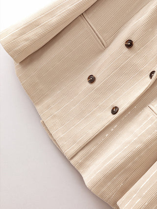 Beige pinstripe shimmer double-breasted blazer, dark buttons close-up
