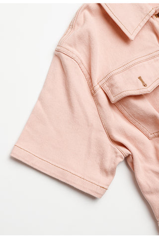 Pink cotton denim shirt dress with short sleeves and side seam, chest pocket edge.