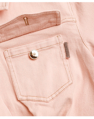 Pink cotton denim shirt dress with front flap pocket, snap button, and stitching.