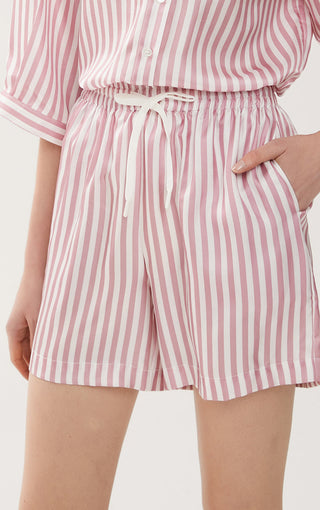 Light pink striped shorts with elastic waist and white drawstring tie