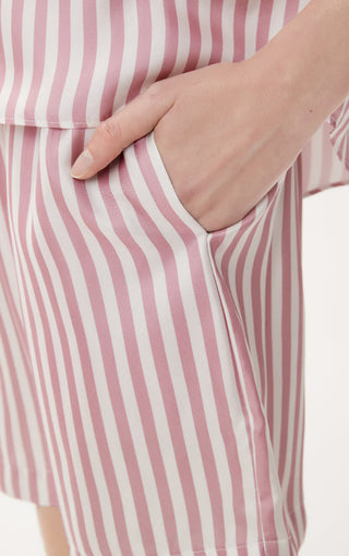Light pink and white striped pocket shorts fabric close-up with side seam