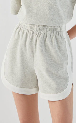 Light gray cotton stretch pocket-detail shorts, elastic waist, white hem trim