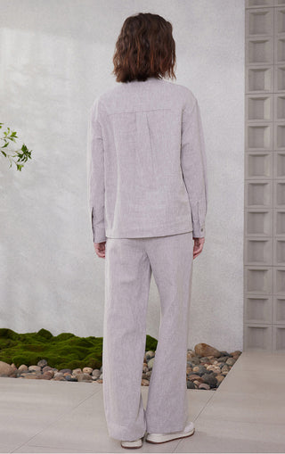 Light purple linen tie-neck utility shirt and matching trousers, back view