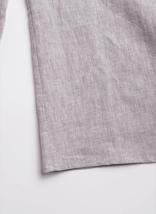Light purple linen shirt hem panel, smooth woven texture