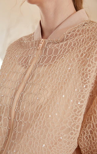 Apricot embroidered mesh jacket detail: raised zip, stand collar, and beaded accents
