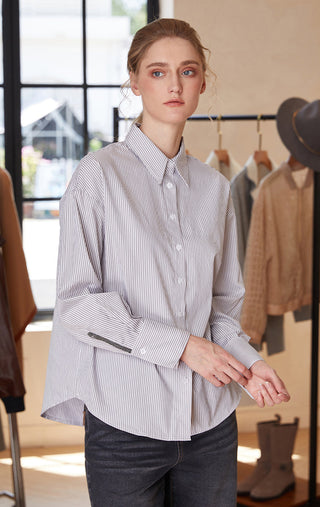 Striped cotton-blend shirt with pointed collar and beaded cuff detail, three-quarter view