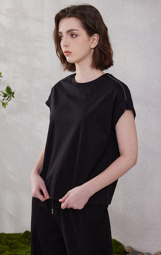 Black cotton short-sleeve top, crew neck and side piping seams, loose silhouette