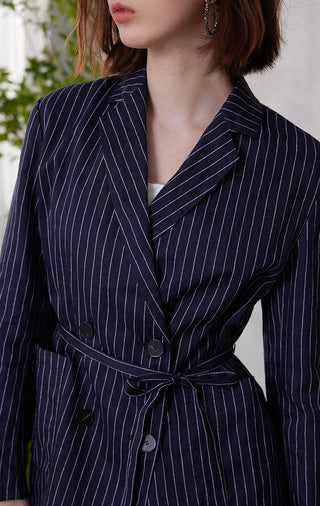 Pinstripe lapel and waist tie on dark blue double-breasted blazer