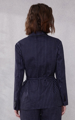 Back view of dark blue pinstripe double-breasted blazer with waist tie belt